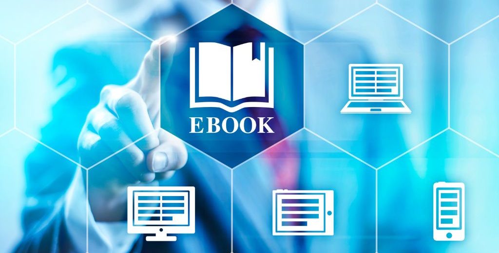 Businessperson touching virtual ebook icon on a digital screen with device icons around.