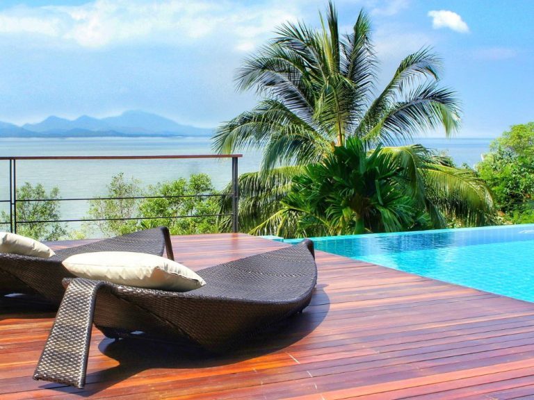 Sitting set up in the swimming pool with a nice view of the ocean.