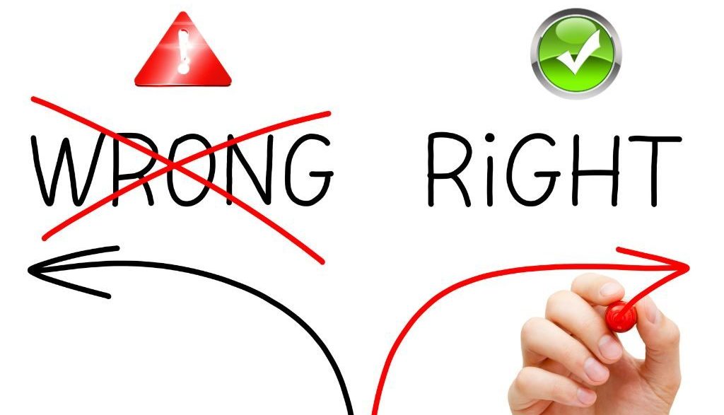 Hand drawing two arrows: one pointing left toward "Wrong" with a red cross and warning symbol, and another pointing right toward "Right" with a green check mark, symbolizing correct decision-making.
